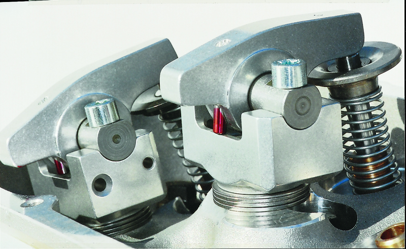The nose wheel, having traveled to the outside of center at half lift, has come back to the center of the valve stem at full lift (valve all the way open). This is proper rocker arm geometry.